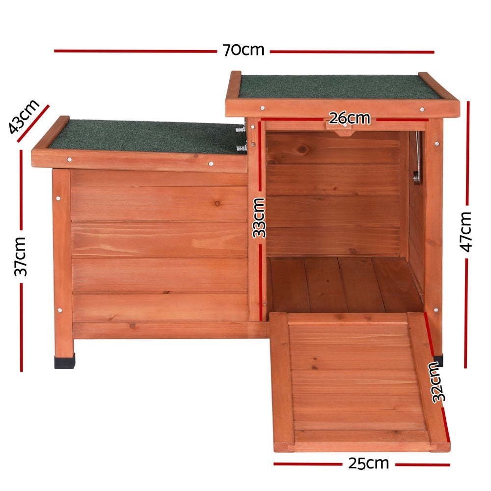 Brown and green wooden outdoor cat house with sloped asphalt roof and drop-down entry ramp — view 2