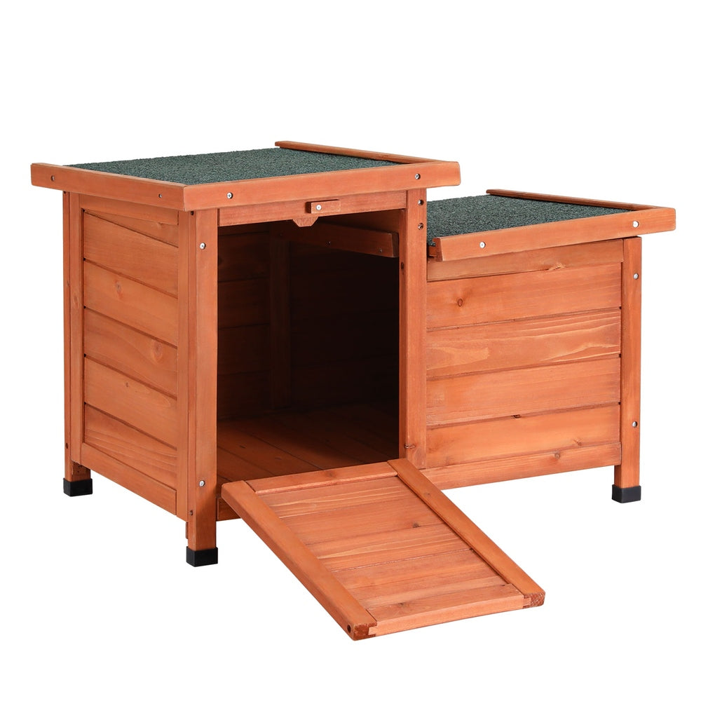 Brown and green wooden outdoor cat house with sloped asphalt roof and drop-down entry ramp — view 3