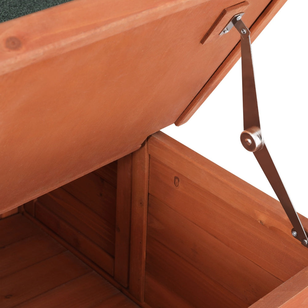 Brown and green wooden outdoor cat house with sloped asphalt roof and drop-down entry ramp — view 4