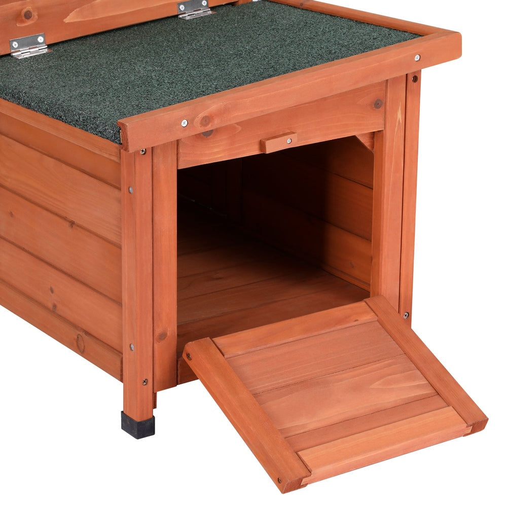 Brown and green wooden outdoor cat house with sloped asphalt roof and drop-down entry ramp — view 5