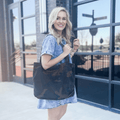 Kristy canvas tote bag in green camo print featuring vintage styling and durable shoulder straps