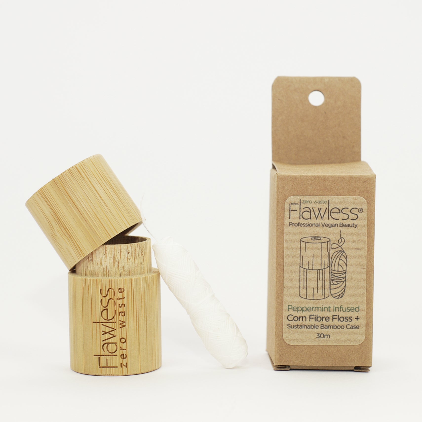 Compostable peppermint dental floss in a reusable natural bamboo cylindrical dispenser — view 4