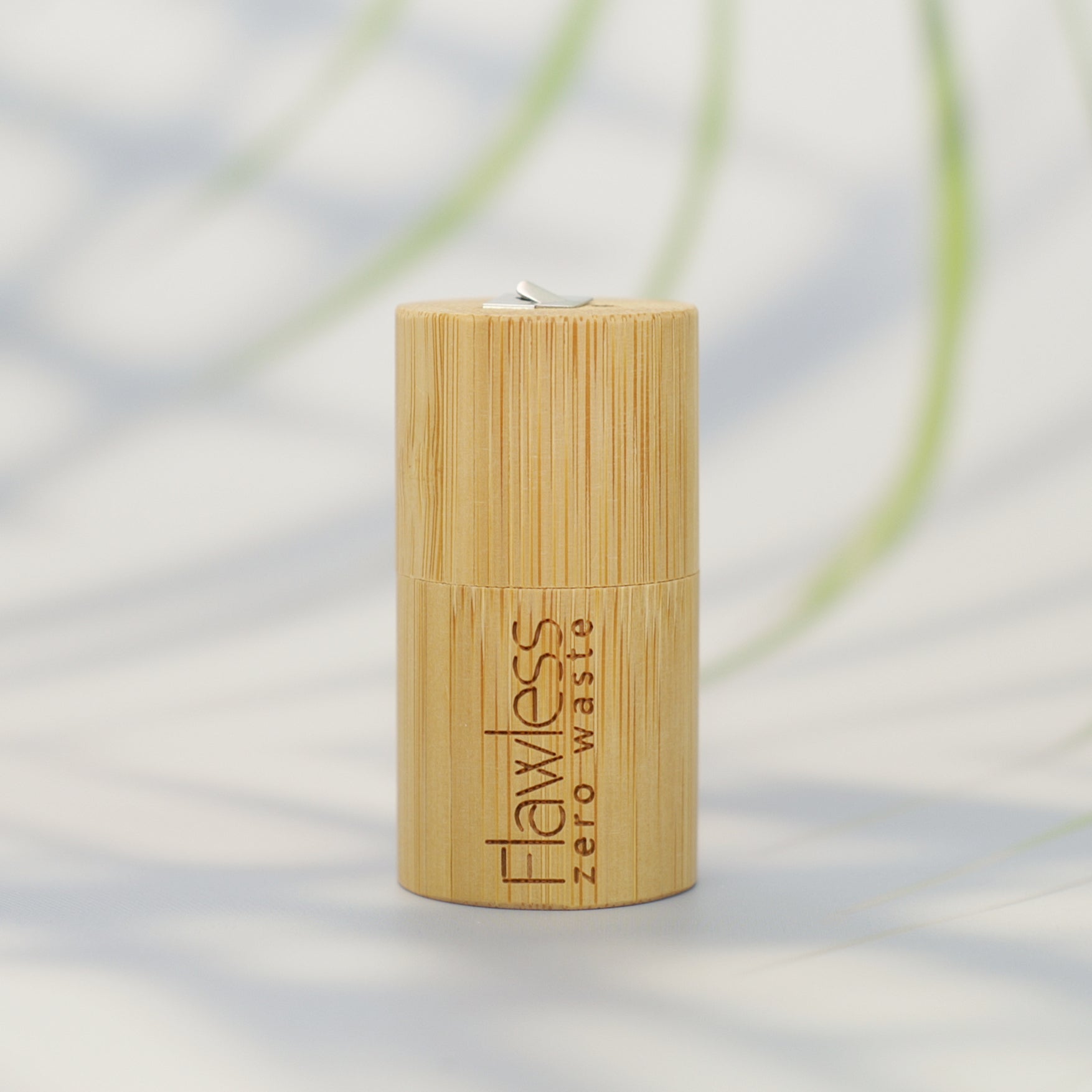 Compostable peppermint dental floss in a reusable natural bamboo cylindrical dispenser — view 5