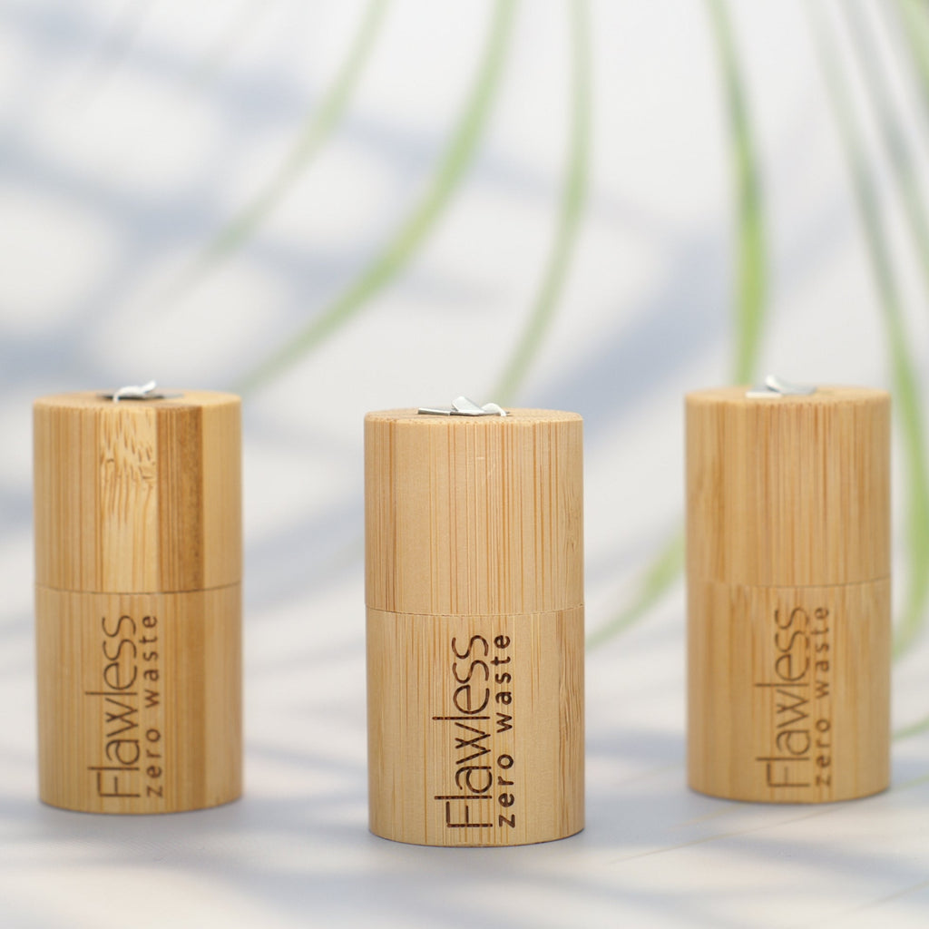 Compostable peppermint dental floss in a reusable natural bamboo cylindrical dispenser — view 3