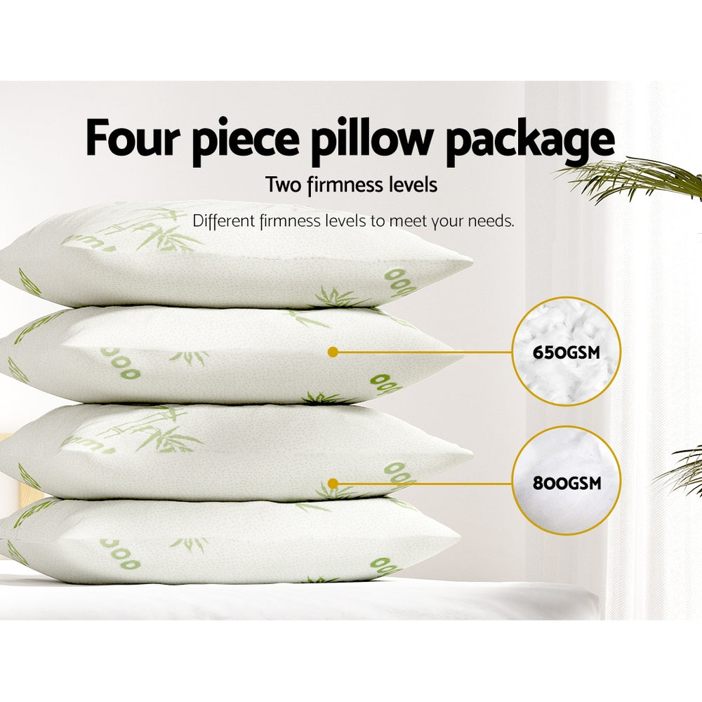 Four white bamboo fabric pillows stacked together with two firm and two medium support variations — view 4