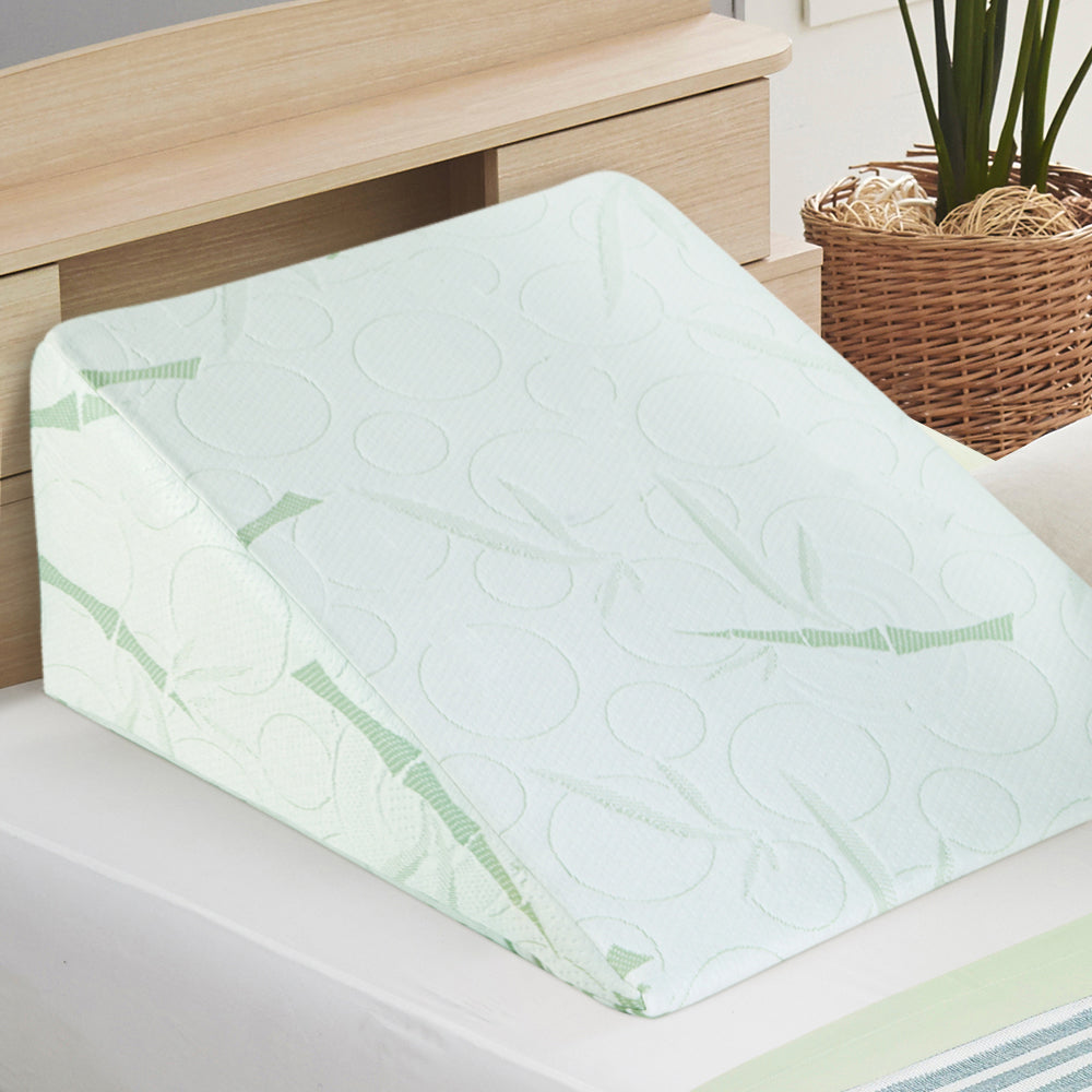 White memory foam bed wedge pillows with waterproof zippered covers for back and leg support.