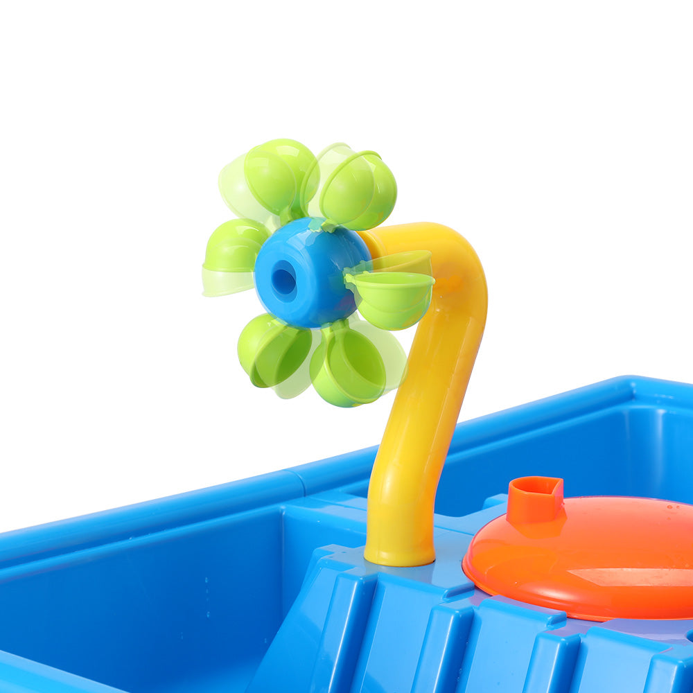 Multicolor kids sand and water play table with rotating windmill, water slide, and toy shovels. — view 4