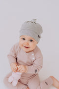 Bamboo viscose baby hat in soft fabric with adjustable top knot for newborn comfort and protection