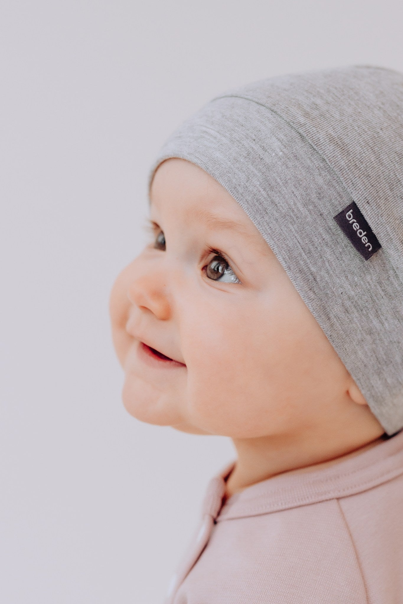 Bamboo viscose baby hat in soft fabric with adjustable top knot for newborn comfort and protection — view 2