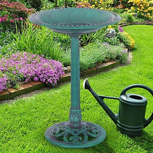 Green resin pedestal bird bath with copper verdigris effect on outdoor garden lawn — view 2