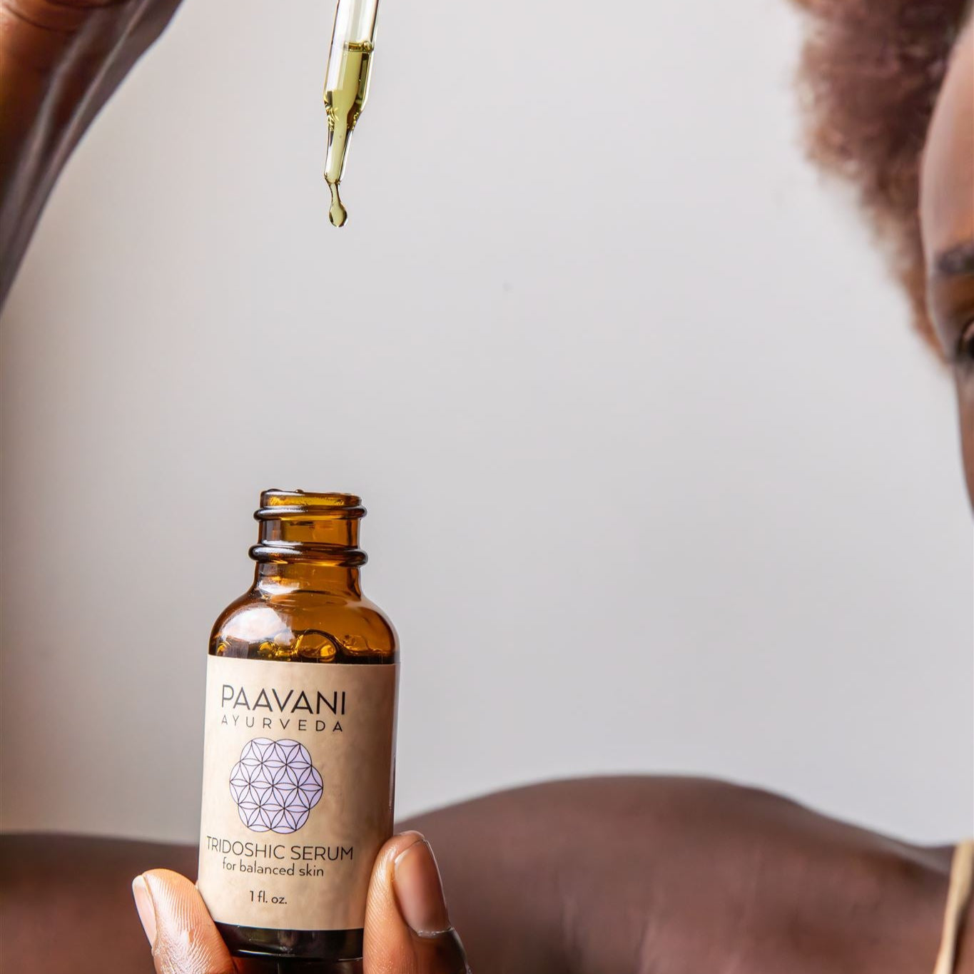 Tridoshic face serum in an earth-friendly amber glass bottle with a dropper cap — view 5
