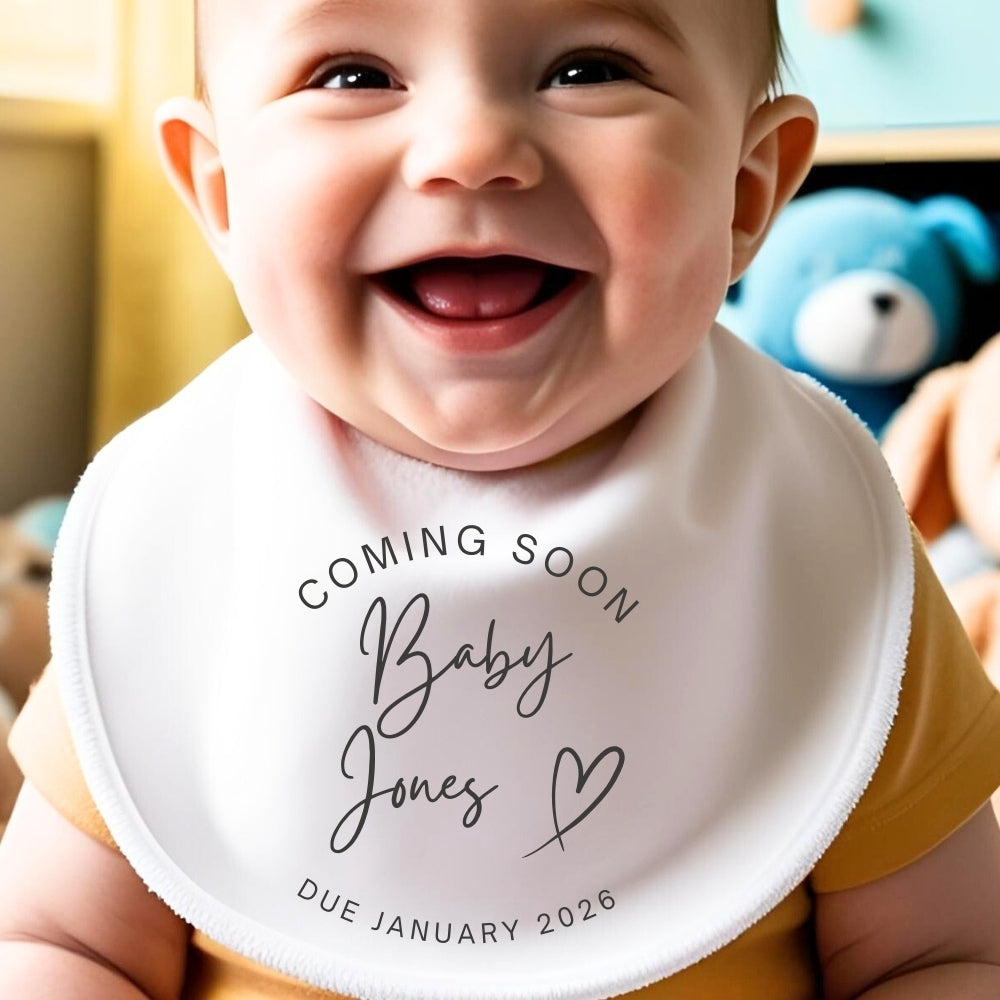 Personalised coming soon baby outfit in white with custom name and due date printed on front — view 2