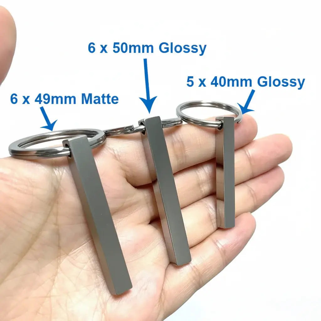 Personalized 3D bar keychain in matte black stainless steel with four-sided custom text engraving — view 4