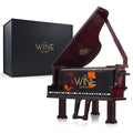 Piano shaped whiskey decanter crafted from mahogany wood with lifting lid and internal glass dispenser