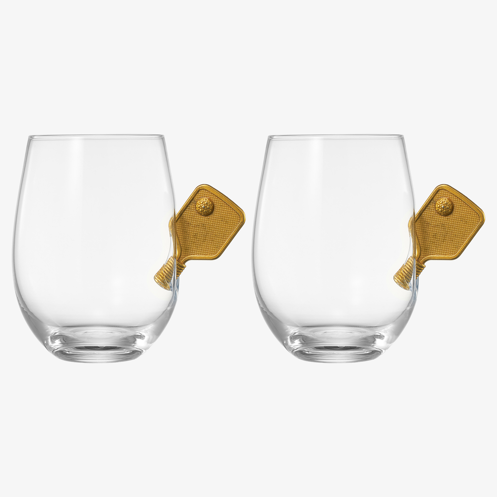 Two pickleball stemless wine glasses with decorative 3D gold racket details on a plain background — view 4