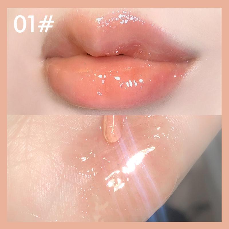 Plumping pink lip gloss tube with holographic shine highlighting a nourishing and volumizing cosmetic formula — view 2