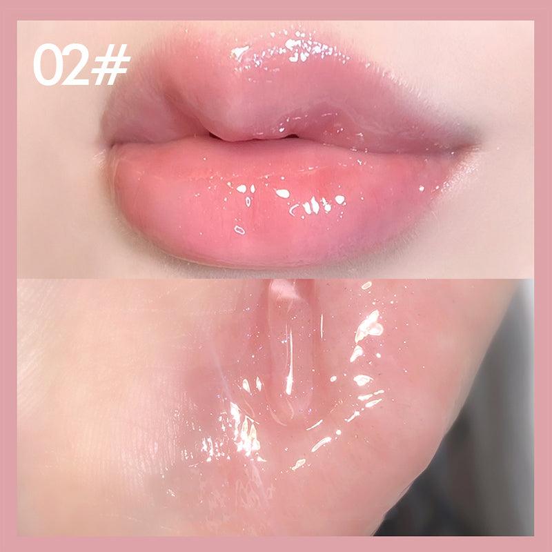 Plumping pink lip gloss tube with holographic shine highlighting a nourishing and volumizing cosmetic formula — view 3