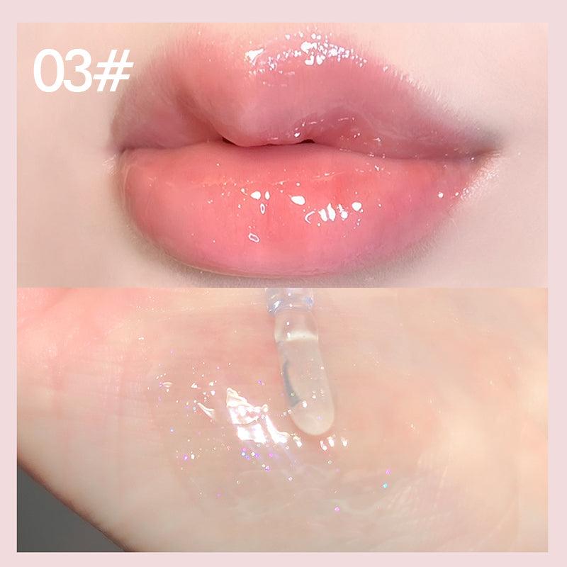 Plumping pink lip gloss tube with holographic shine highlighting a nourishing and volumizing cosmetic formula — view 4