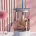 Portable electric makeup brush cleaner in gray and white with USB charger and cleaning bowl