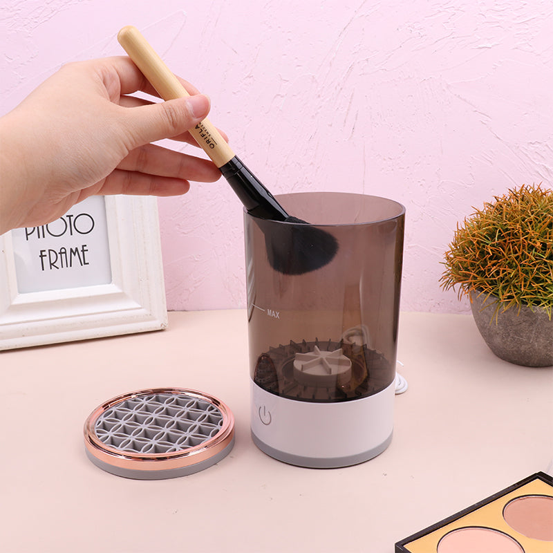 Portable electric makeup brush cleaner in gray and white with USB charger and cleaning bowl — view 3