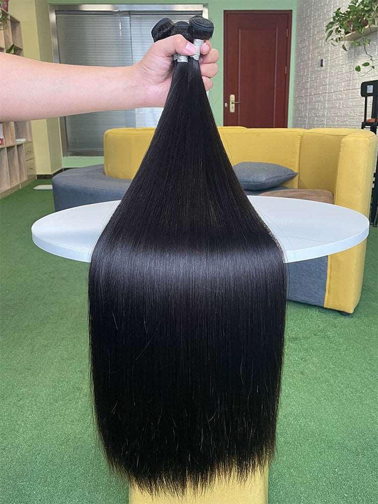Premium human hair extensions in natural color showing smooth tangle free texture and healthy ends — view 4