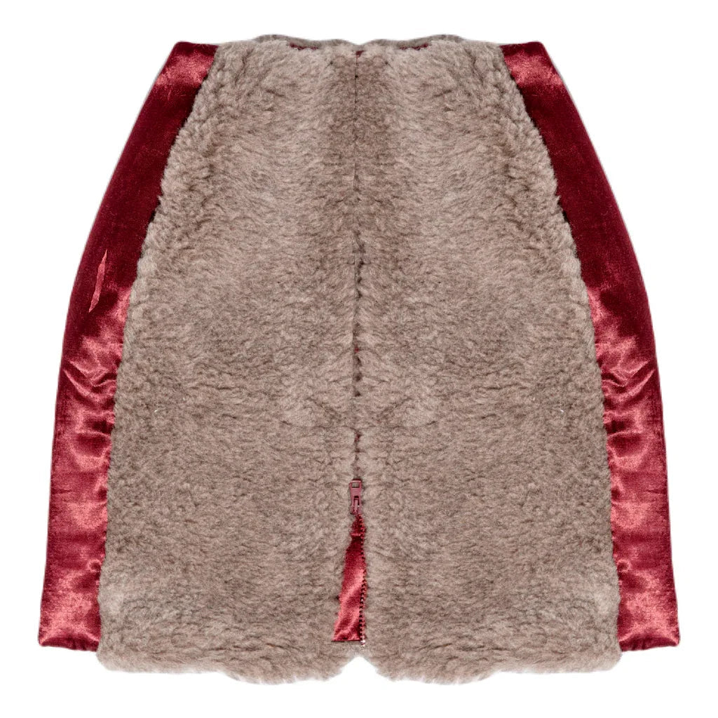 Beige structured wool mini skirt with bold front zipper and burgundy silk cotton insets.