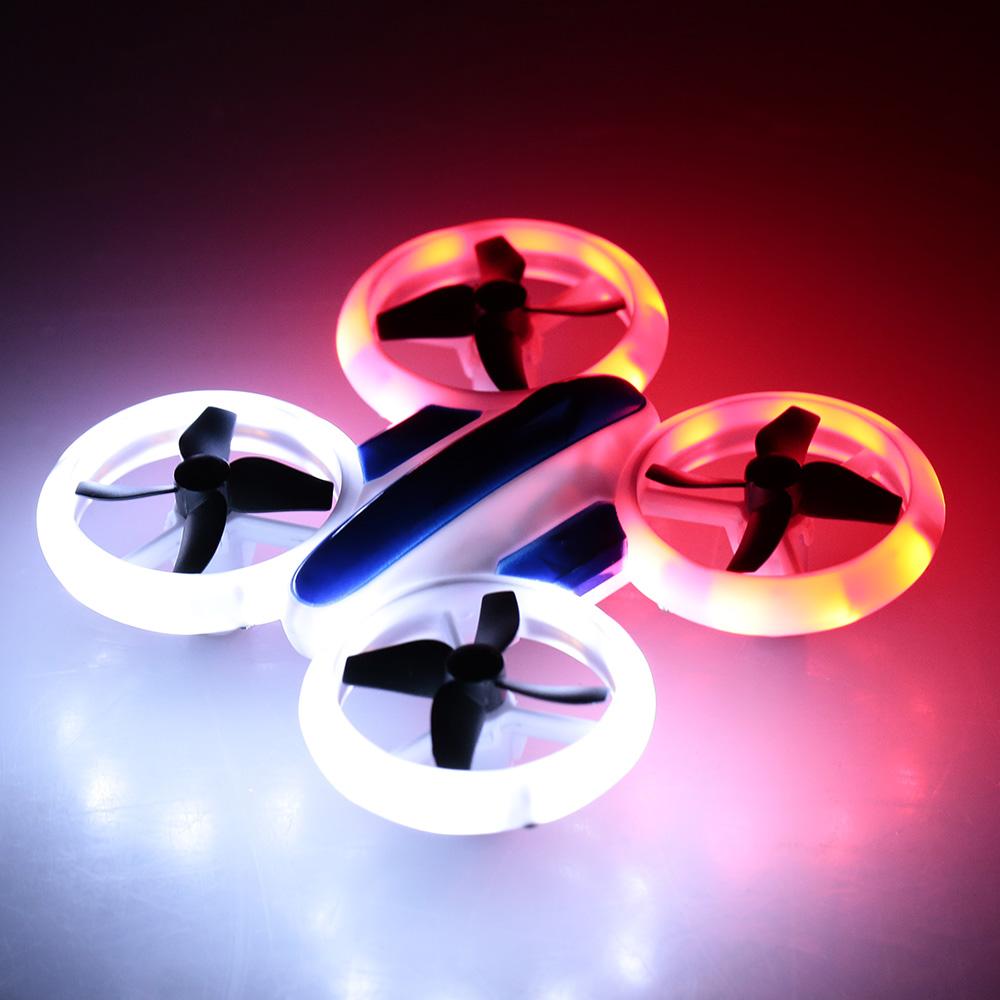 Remote control quadcopter drone with protective guards and bright LED lights ready for flight