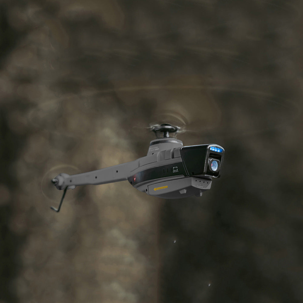 Mini RC helicopter with camera in grey plastic, featuring four propellers and flybarless design. — view 5