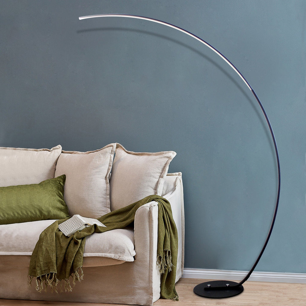 Modern RGBW curved floor lamp with metal arc emitting vibrant color changing light in living room — view 5