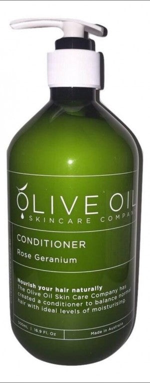 Rose geranium hair conditioner in a 500ml pump bottle with natural olive oil botanical branding. — view 3