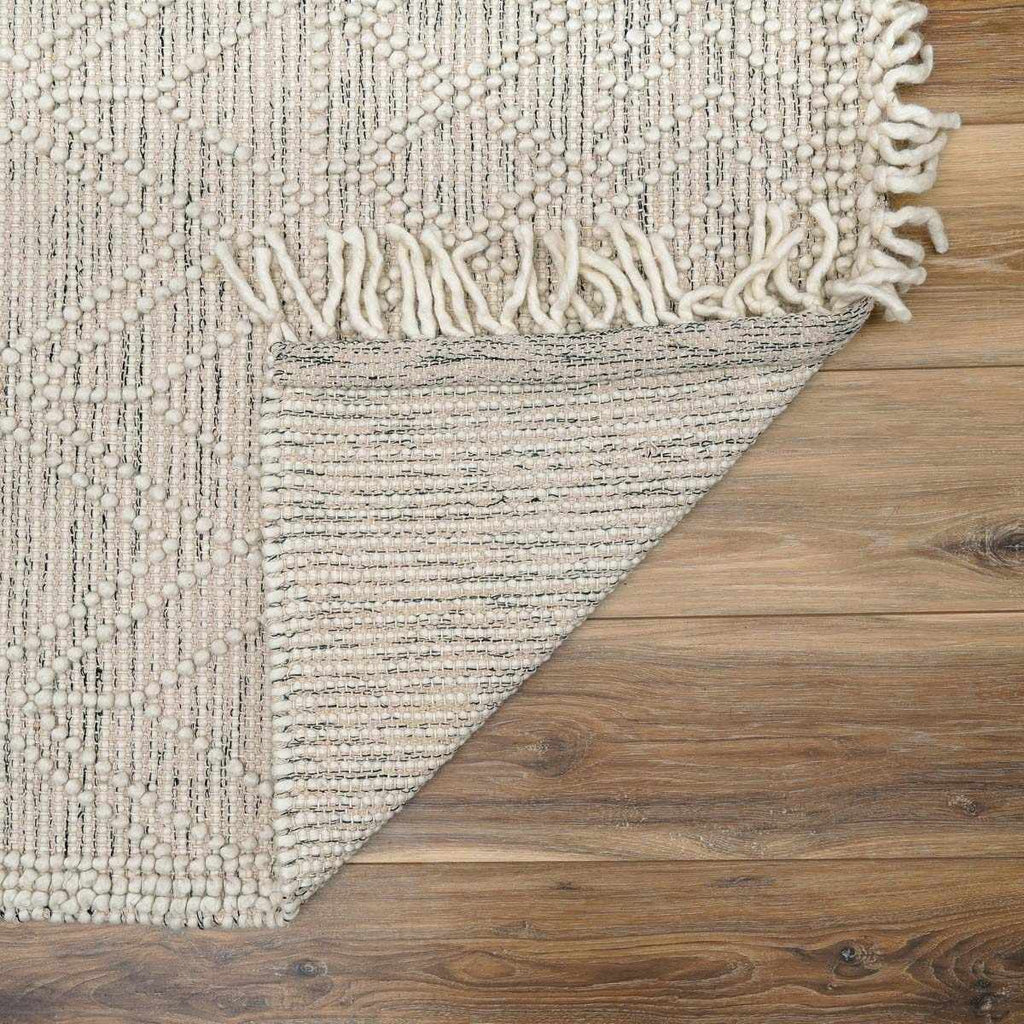 Ivory and black handwoven Ramsbury wool area rug with geometric pattern and corner tassels — view 5