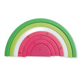 Silicone rainbow building blocks arranged in a watermelon shape for baby sensory and open-ended play