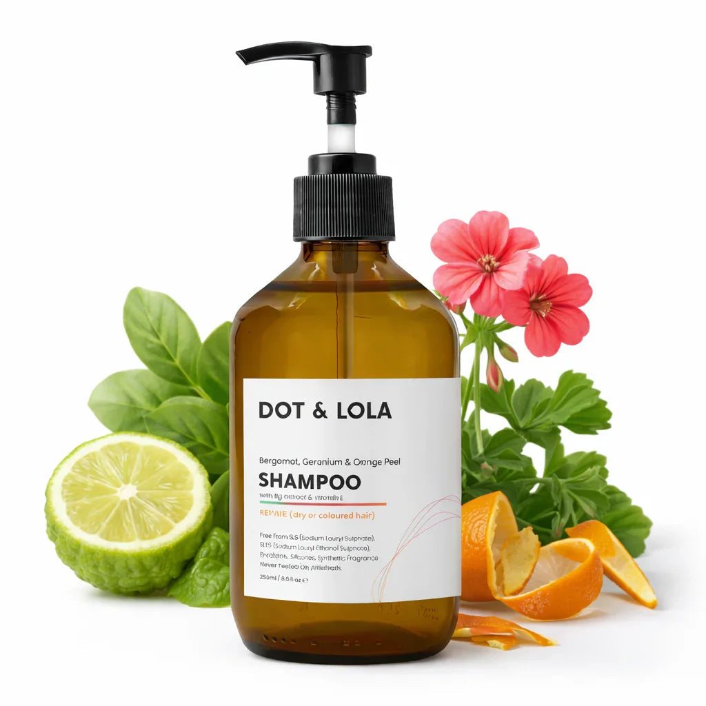 Plant-based repair shampoo bottle for dry and damaged hair, featuring natural orange and bergamot extracts