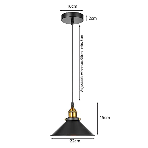 Three black industrial metal pendant lights hanging over a dining table with vintage Edison bulbs. — view 3
