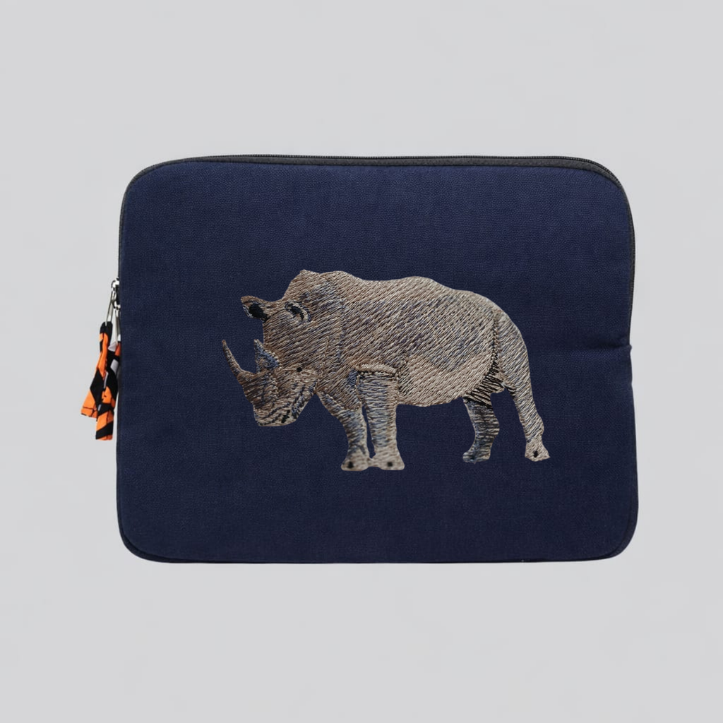 Rhino laptop sleeve made of Kenyan cotton canvas with animal embroidery in warm earthy colors — view 2
