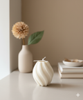 Ribbed twirl candle in sculptural twisted design, made of white handcrafted eco-friendly soy wax