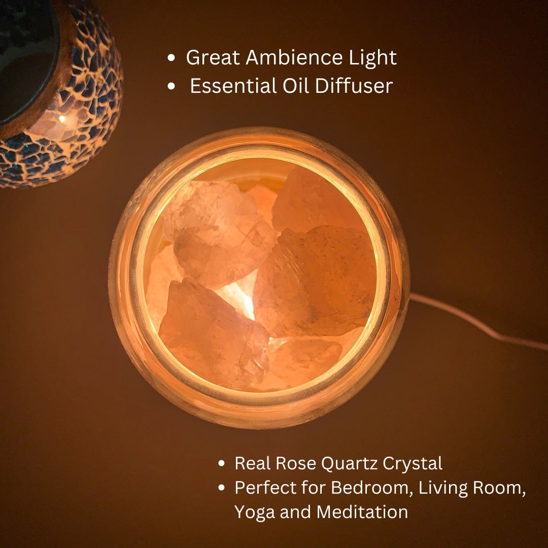 AURORA natural quartz crystal essential oil diffuser with wooden base and glass reservoir illuminated. — view 2