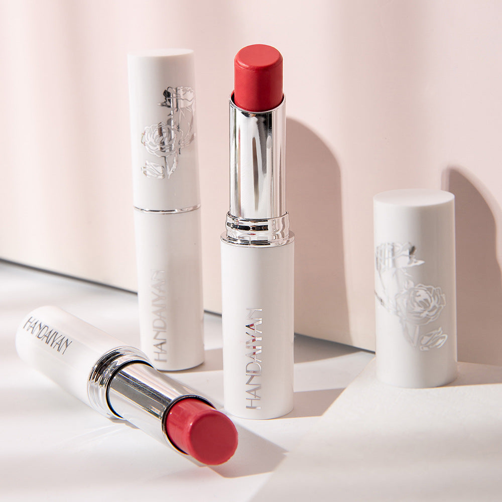 Rosy lipstick collection tube showing vibrant charming red lip color enriched with rose essential oil