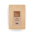 Freshly roasted Rwanda whole coffee beans in an eco-friendly kraft paper bag.