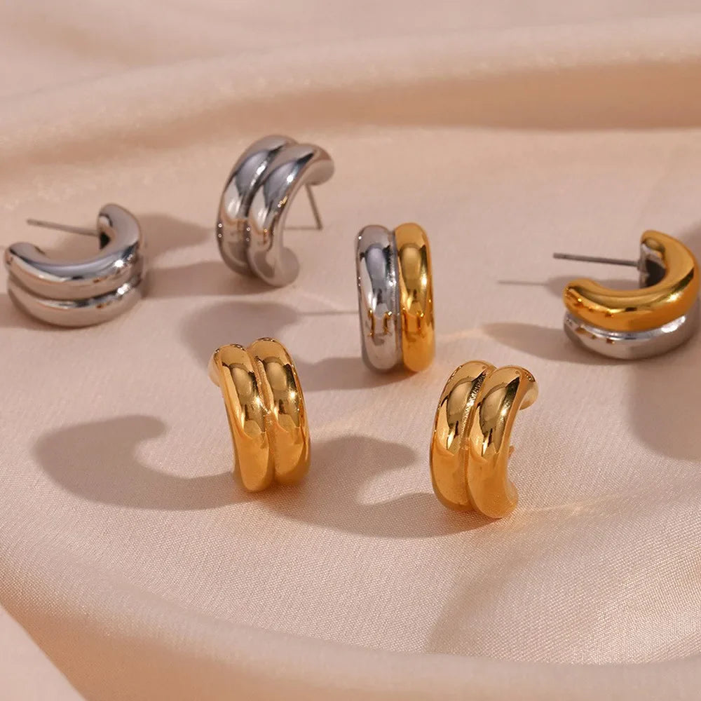 Gold plated geometric stud earrings made of hypoallergenic stainless steel on a clean background — view 5