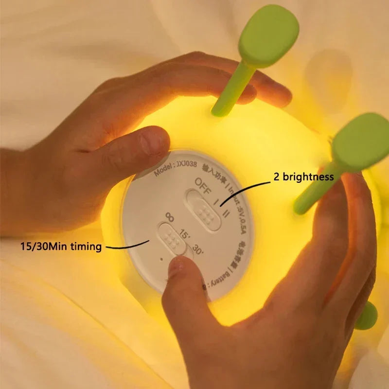 Cute mango night light made of soft silicone emitting a warm glow for bedside decor — view 4