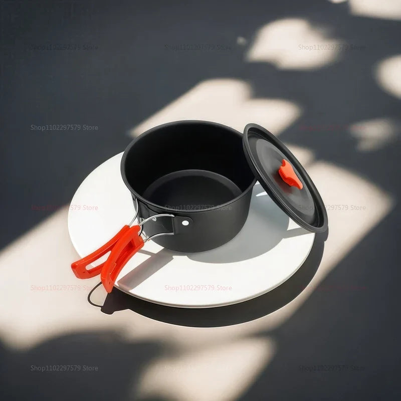 Grey aluminum camping cookware set featuring a pot, kettle, and foldable heat-resistant handles. — view 3