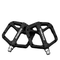 Black ultralight flat platform bicycle pedals made of nylon composite with anti-skid traction pins