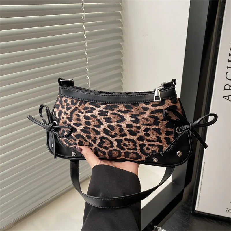 Trendy retro double bow shoulder bag for women featuring a sleek and minimalist underarm silhouette — view 5