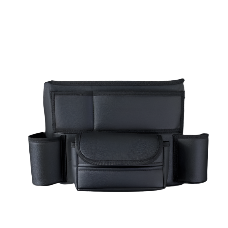 Black leather car seat storage bag hanging between front seats holding a handbag