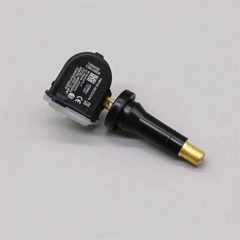 Four black tire pressure monitoring system sensors for vehicle safety and maintenance — view 4