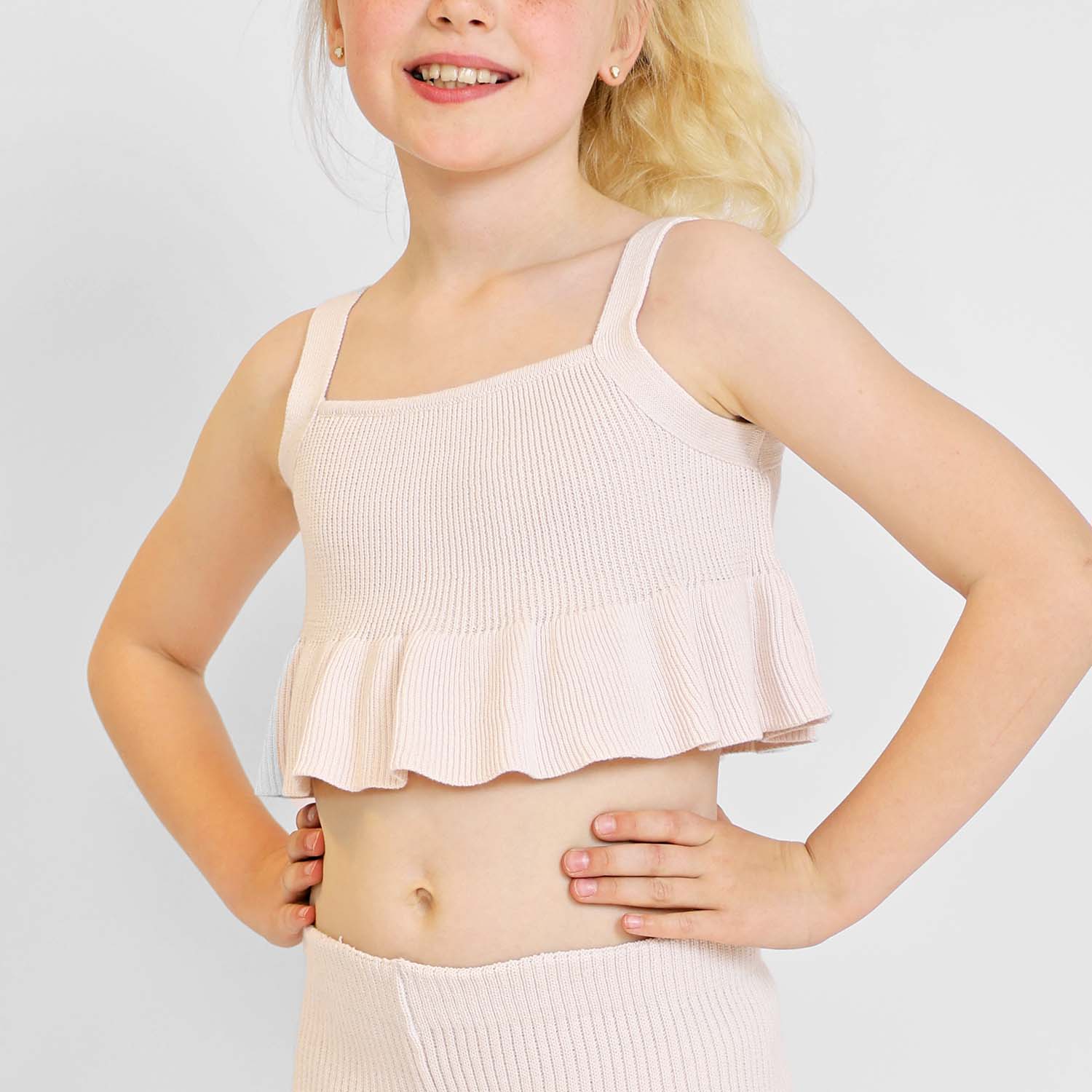 Pink crop top for girls in organic cotton knit with playful ruffled hem — view 5