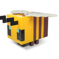 Creative bee night light illuminating a soft LED glow on a child's bedroom bedside table