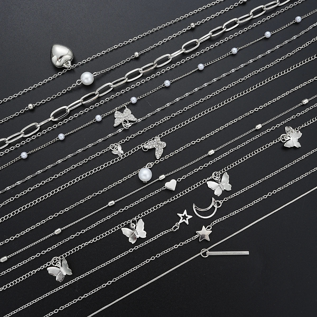 13-piece silver women's necklace set featuring heart, butterfly, pearl, and star charm pendants — view 5