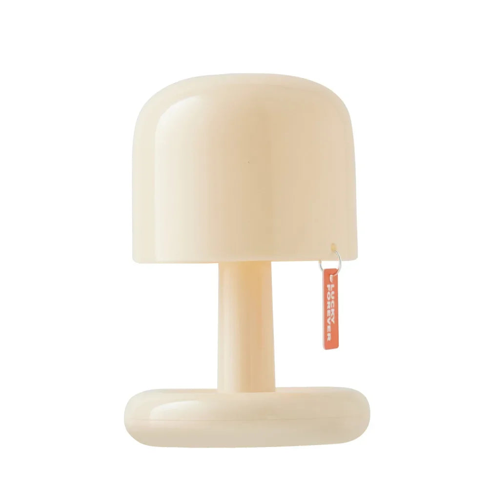 Compact LED mini sunset night light projecting a warm golden glow onto a blank wall